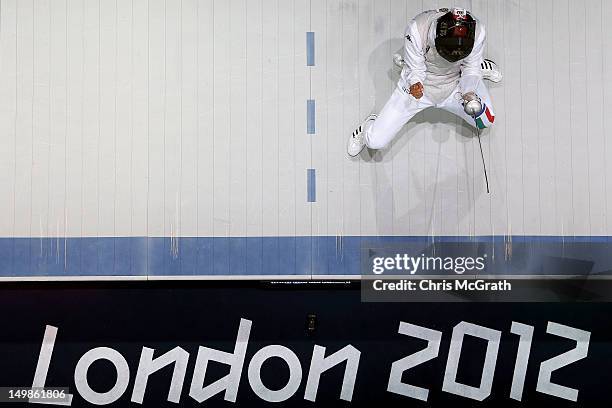 Andrea Baldini of Italy celebrates scoring a point against Yuki Ota of Japan in the Men's Foil Team Fencing finals on Day 9 of the London 2012...