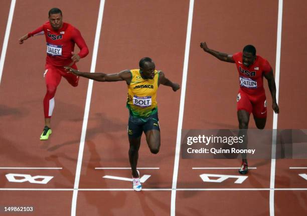 Usain Bolt of Jamaica crosses the finish line ahead of Ryan Bailey of the United States and Justin Gatlin of the United States to win the Men's 100m...