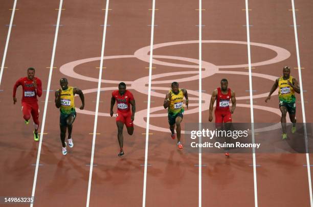 Usain Bolt of Jamaica runs ahead of Ryan Bailey of the United States, Yohan Blake of Jamaica, Justin Gatlin of the United States, Asafa Powell of...