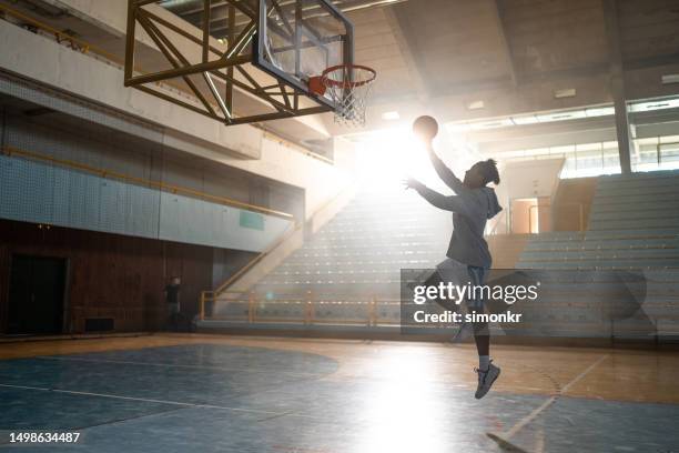 man playing basketball - making a basket stock pictures, royalty-free photos & images