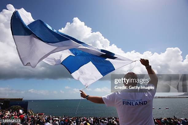 Finnish supporter watchs from The Nothe during the Men's Star Sailing Medal Race on Day 9 of the London 2012 Olympic Games at the Weymouth & Portland...