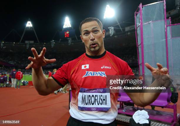 Koji Murofushi of Japan celebrates winning bronze in the Men's Hammer Throw Final on Day 9 of the London 2012 Olympic Games at the Olympic Stadium on...