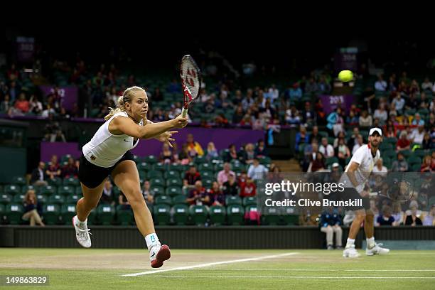 Sabine Lisicki of Germany and Christopher Kas of Germany in action during the Mixed Doubles Tennis bronze medal match against as Lisa Raymond of the...