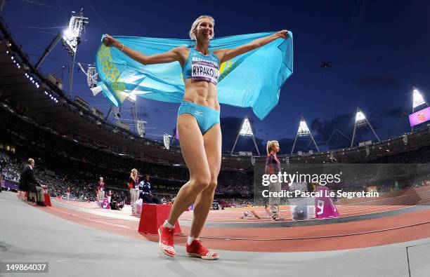 Olga Rypakova of Kazakhstan celebrates winning gold in the Women's Triple Jump on Day 9 of the London 2012 Olympic Games at Olympic Stadium on August...