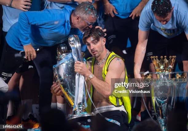 Jack Grealish of Manchester City with the UEFA Champions League trophy on stage in St Peter's Square during the Manchester City trophy parade on June...