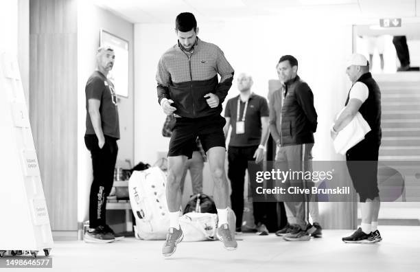Novak Djokovic of Serbia warms up moments before walking out on to the court for his second round match on Day 4 of the 2023 French Open at Roland...