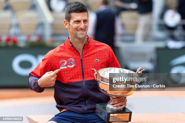 Novak Djokovic of Serbia with the winner's trophy after his victory against Casper Ruud of Norway in the Men's Singles Final on Court Philippe...