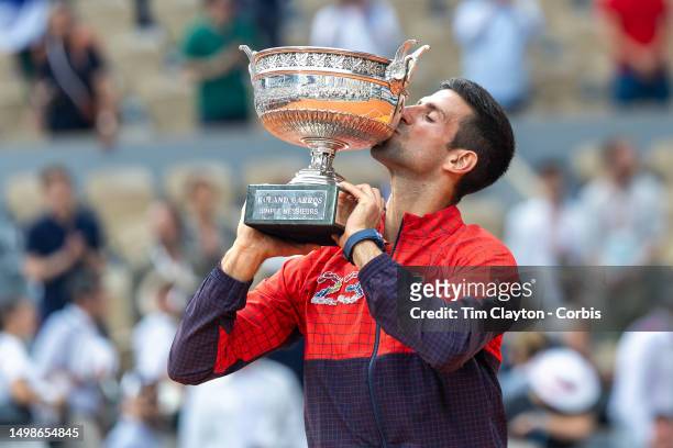 Novak Djokovic of Serbia with the winner's trophy after his victory against Casper Ruud of Norway in the Men's Singles Final on Court Philippe...