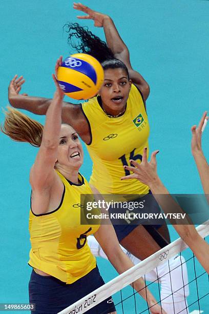Brazil's Thaisa Menezes spikes against Serbia during their London 2012 Olympic Games women's preliminary pool B volleyball match in London on August...