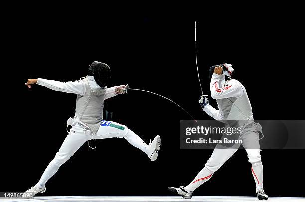 Andrea Baldini of Italy competes against Yuki Ota of Japan in the gold medal match of the Men's Foil Team Fencing finals on Day 9 of the London 2012...