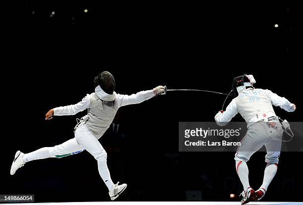 Andrea Baldini of Italy competes against Kenta Chida of Japan in the gold medal match of the Men's Foil Team Fencing finals on Day 9 of the London...