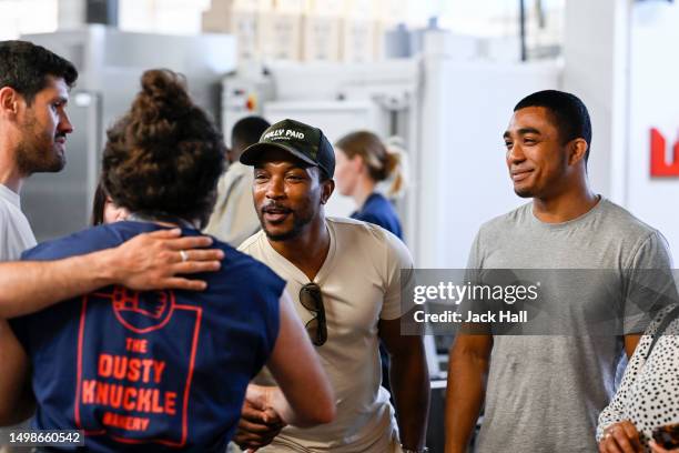 Ashley Walters shakes hands with a trainee during his visit to The Dusty Knuckle bakery ahead of their youth fundraiser event to raise money for The...