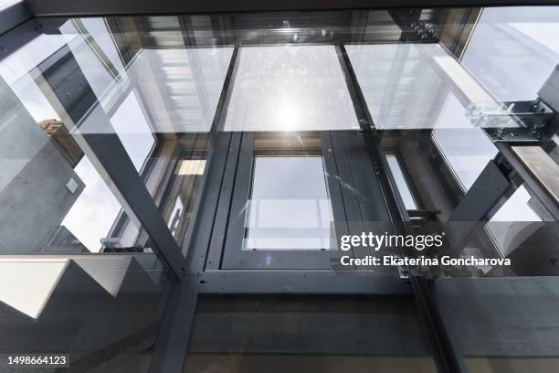 abstract background with transparent elevator - ascensor fotografías e imágenes de stock