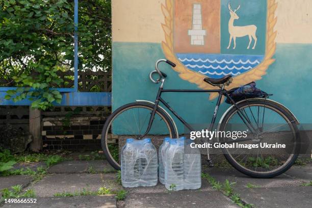 Bottles with fresh water stand near bicycle on June 13, 2023 in Novovorontsovka, Ukraine.