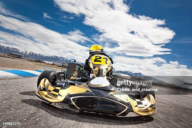 go kart racer speeding around track - go kart bildbanksfoton och bilder