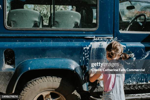 `a child washes a vintage car - hubcap stock pictures, royalty-free photos & images