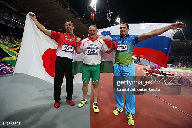 Bronze medalist Koji Murofushi of Japan, gold medalist Krisztian Pars of Hungary and silver medalist Primoz Kozmus of Slovenia celebrate after the...