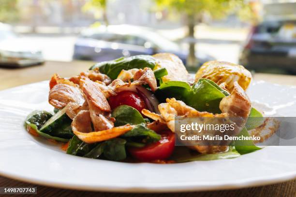 two eggs benedict with fresh salad and fried bacon - mustard sauce stock pictures, royalty-free photos & images