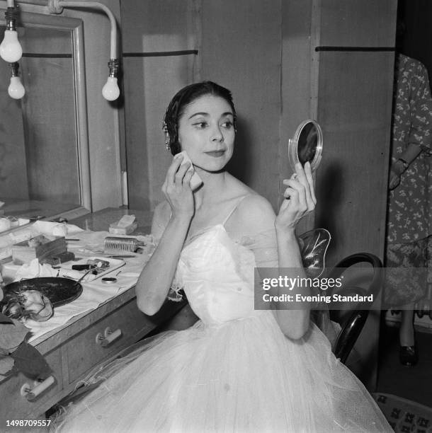 Ballerina Dame Margot Fonteyn applying makeup in her dressing room, May 14th 1959.