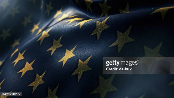 glänzende goldene sterne auf dunkelblauem wehendem flaggenurlaubshintergrund - american flag texture stock-fotos und bilder
