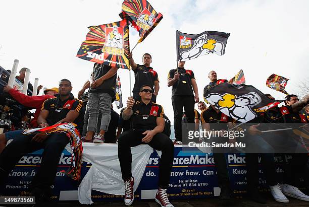 Maritino Nemani and Sonny Bill Williams sit with the team on the truck as they celebrate during a victory parade after winning the 2012 Super Rugby...
