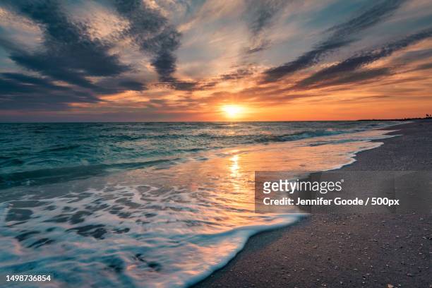 scenic view of sea against sky during sunset,sanibel,florida,united states,usa - sanibel island stock pictures, royalty-free photos & images
