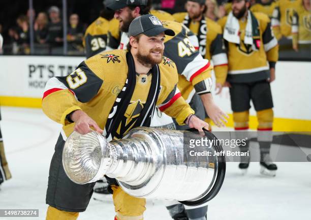 Teddy Blueger of the Vegas Golden Knights celebrates with the Stanley Cup after a 9-3 victory against the Florida Panthers in Game Five of the 2023...