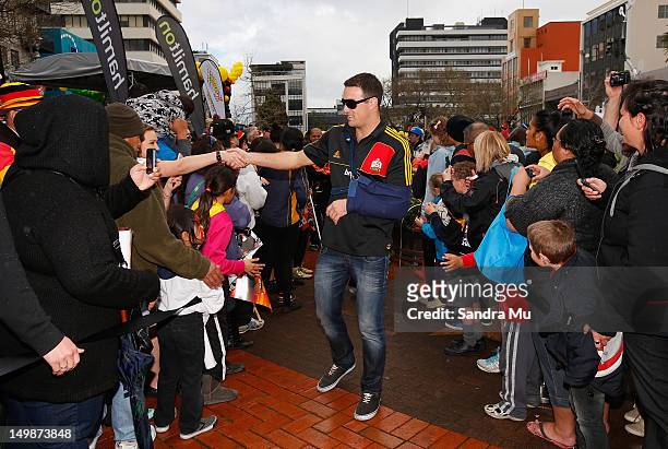 Richard Kahui of the Chiefs is congratulated by fans during a victory parade after winning the 2012 Super Rugby final against the Sharks, on August...