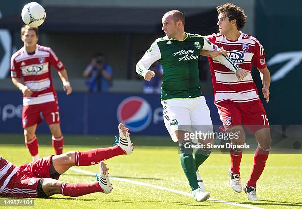 Kris Boyd of Portland Timbers and George John of FC Dallas watch the ball in the first half of the MLS match at Jeld-Wen Field on August 5, 2012 in...