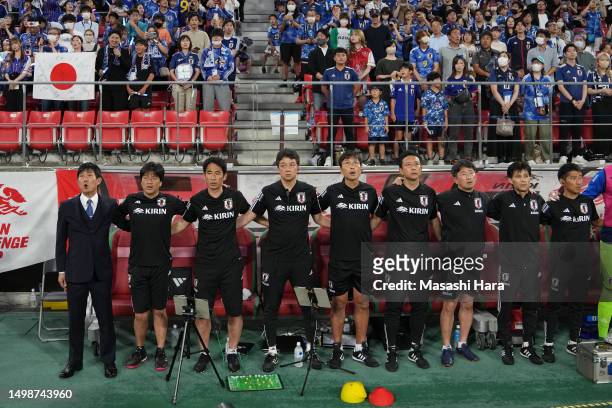 Hajime Moriyasu and coaches of Japan line up prior to the international friendly match between Japan and El Salvador at Toyota Stadium on June 15,...