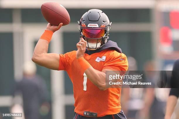 Justin Fields of the Chicago Bears takes part in a drill during minicamp at Halas Hall on June 15, 2023 in Lake Forest, Illinois.
