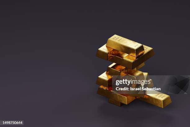 stack of gold ingot on purple background with space for text. - bullion stockfoto's en -beelden