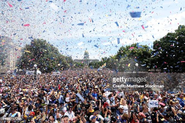 Confetti flies over the crowd during the Denver Nuggets victory parade and rally after winning the 2023 NBA Championship at Civic Center Park on June...