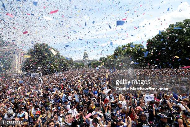 Confetti flies over the crowd during the Denver Nuggets victory parade and rally after winning the 2023 NBA Championship at Civic Center Park on June...