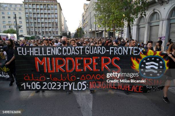 Protesters shout slogans during a demonstration following a deadly migrant shipwreck, on June 15, 2023 in Athens, Greece. A fishing boat carrying...