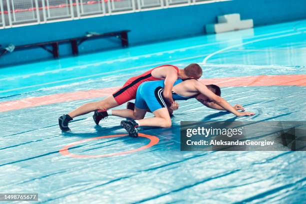 wrestling match in progress - wrestling stock pictures, royalty-free photos & images
