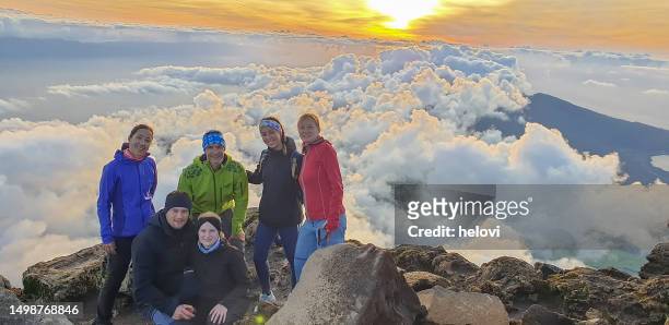 tourists on top ofvolcano mt. pico at sunrise - azores people stock pictures, royalty-free photos & images