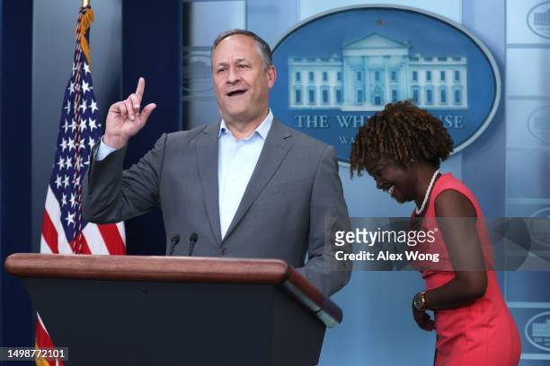 Second gentleman Doug Emhoff tells a joke as White House Press Karine Jean-Pierre reacts in the James S. Brady Press Briefing Room of the White House...