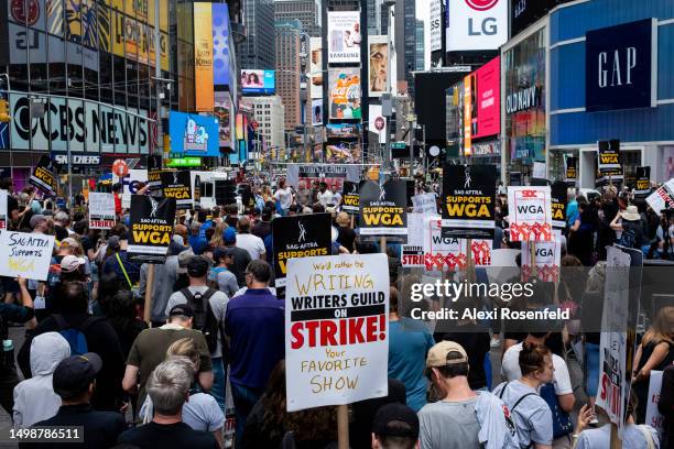 People gather for the 'Broadway Day Rally' hosted by the Writers Guild of America East in Times Square on June 15, 2023 in New York City. As the...