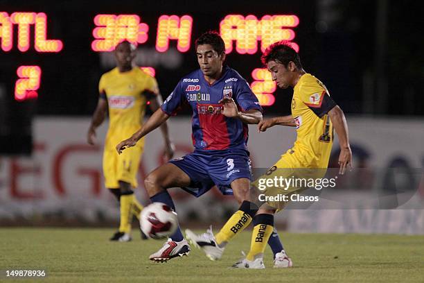Oscar Rojas of Atlante and Christian Bermudez of America fight for the ball during a match between Atlante and America as part of the Liga Mx at...