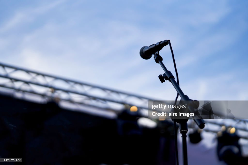 Copy space microphone black color standing with clipping path isolated no people