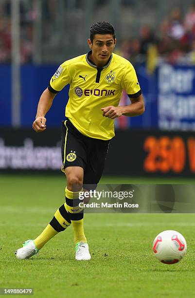 Koray Guenter of Dortmund runs with the ball during the LIGA total! Cup final match between Werder Bremen and Borussia Dortmund at Imtech Arena on...