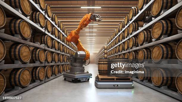 automatisierte roboterträger und roboterarm im weinkeller - weinkeller stock-fotos und bilder