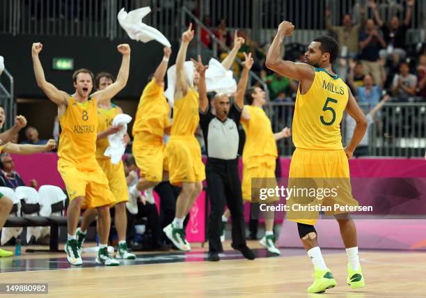 Patrick Mills of Australia celebrates after making the game winning three point shot against Russia in the final seconds of the Men's Basketball...