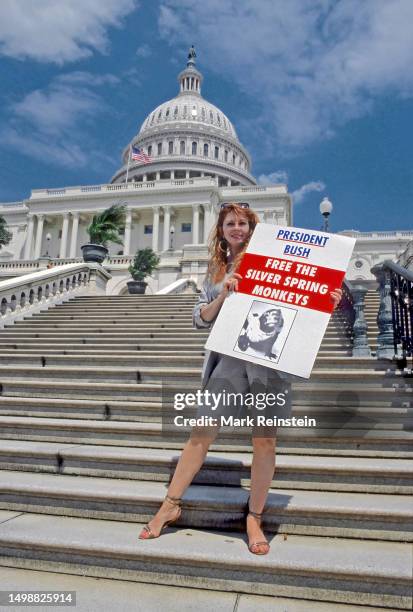 Actress Cassandra Peterson holds a protest sign depicting the Silver Spring Monkeys on the steps of the US Capitol during the animals rights protest...