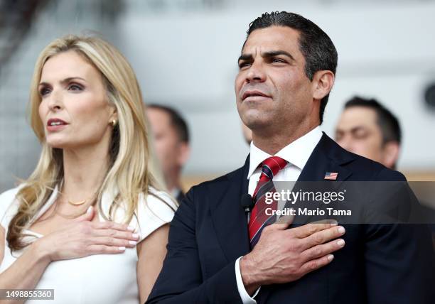 Republican presidential candidate Miami Mayor Francis Suarez and wife Gloria recite the Pledge of Allegiance before he delivered remarks at the...