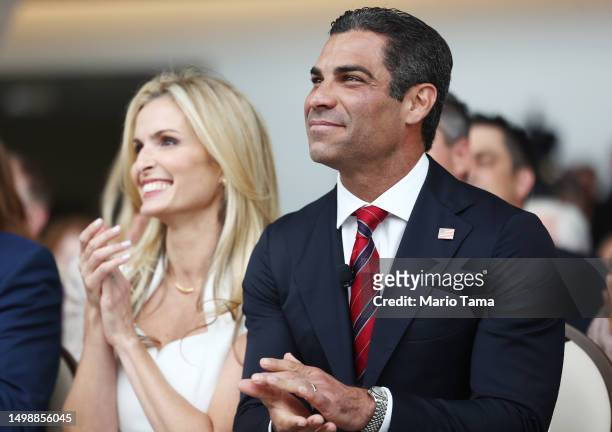 Republican presidential candidate Miami Mayor Francis Suarez and wife Gloria applaud before he delivered remarks at the Ronald Reagan Presidential...