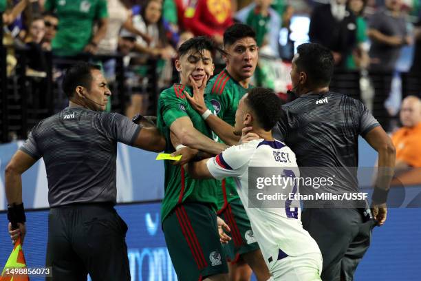 Sergiño Dest of the United States and Gerardo Arteaga of Mexico push each other in the second half during the 2023 CONCACAF Nations League Semifinal...