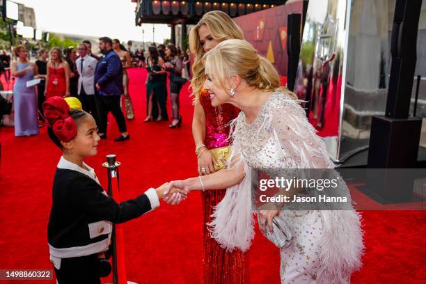 Social media influencer Taylen Biggs is greeted on the red carpet by Tavia Shackles, wife of Clark Hunt prior to the the Chiefs ring ceremony at...