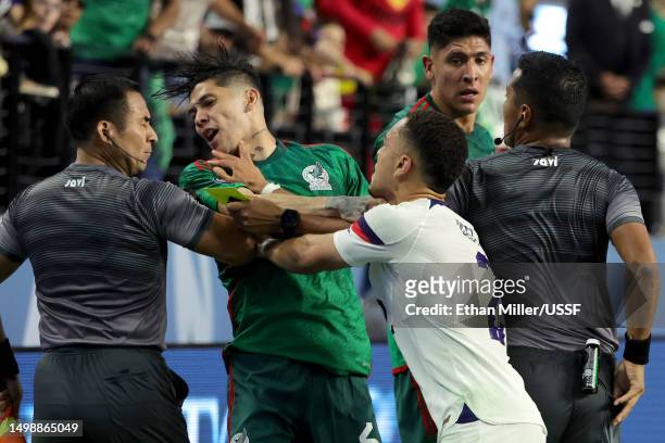 Gerardo Arteaga of Mexico and Sergiño Dest of the United States push each other during the 2023 CONCACAF Nations League Semifinal at Allegiant...
